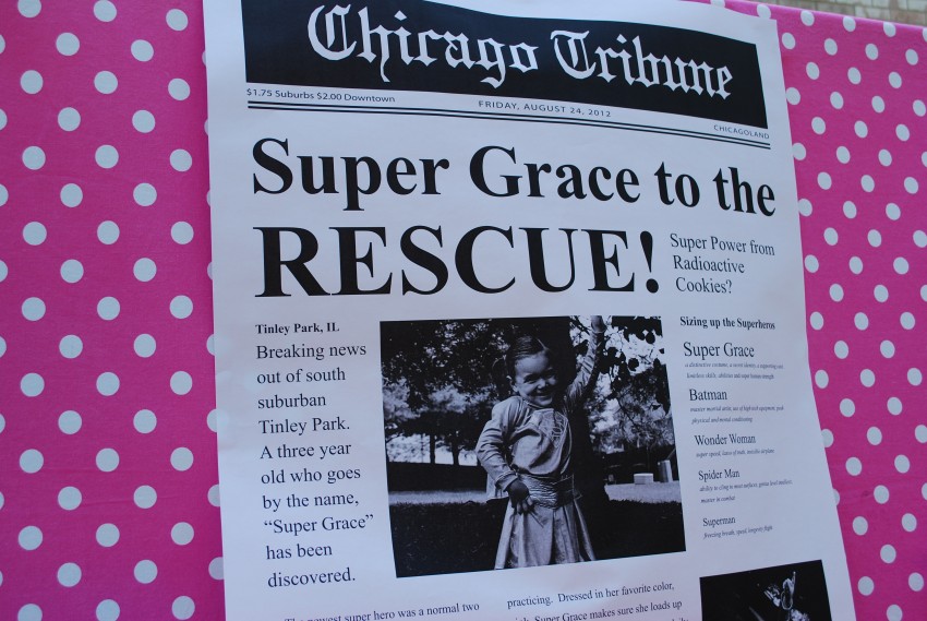 Girl's superhero birthday party - newspaper backdrop